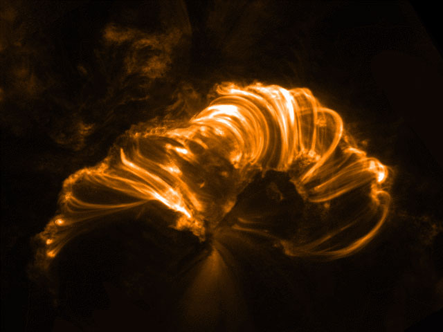 Active Region 9415 on 10 April 2001 at 06:00 UT in 171 (characteristic of emission from gas at 1 million Kelvin). The field of view is 232,000 by 174,000 km; the image was rotated over +120 degrees. These loops are the result of an X2.3 flare that started at 05:06 UT. The flare showed a classic double ribbon structure. As the ribbons spread apart with time the post-flare arcade of cooling, draining loops was formed, expanding with time